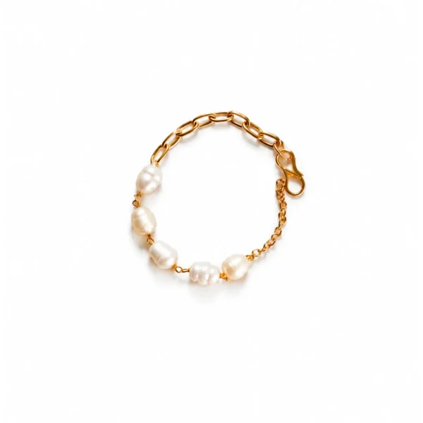 Baroque pearl rakhi for kids with cream pearls on a red and gold cord