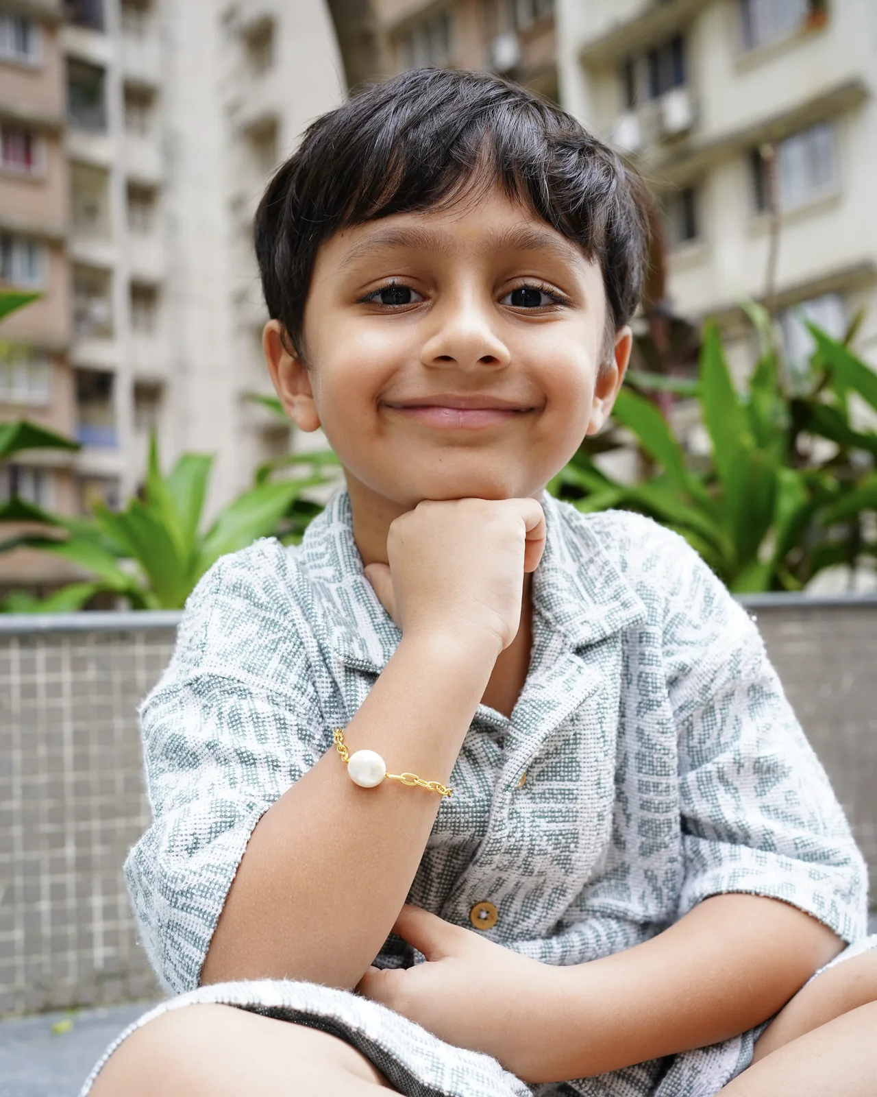The Pearl Link Rakhi worn